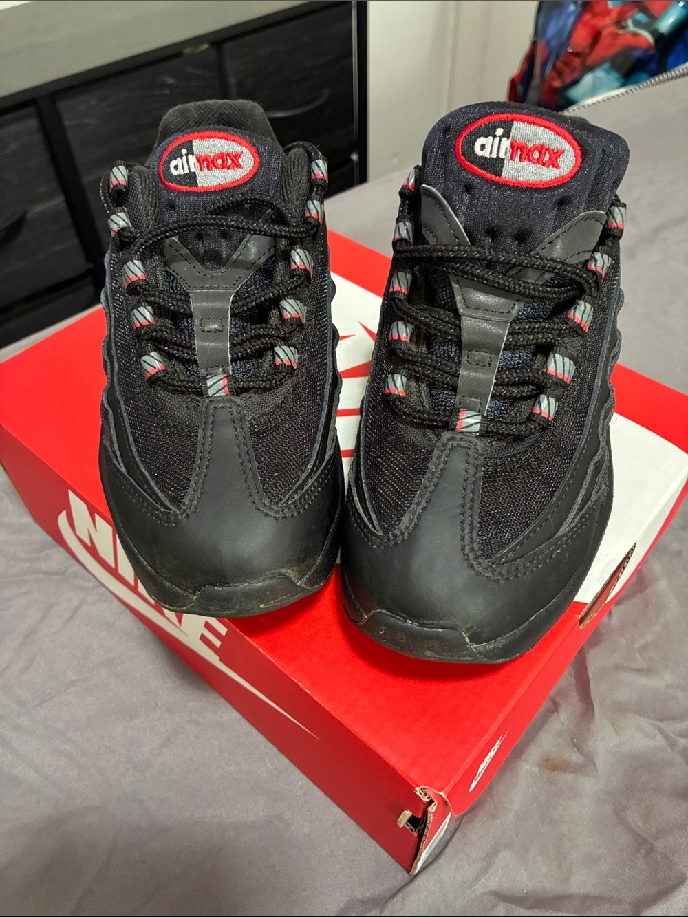 Nike Kids Black Sneakers with Red Detailing